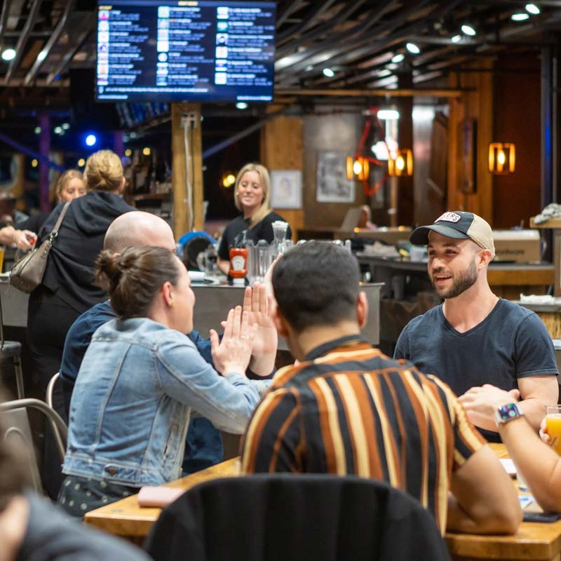 Guests at Cadence Clubhouse taproom, café and restaurant share stories over great food and drinks Guests at Cadence Clubhouse taproom, café and restaurant share stories over great food and drinks